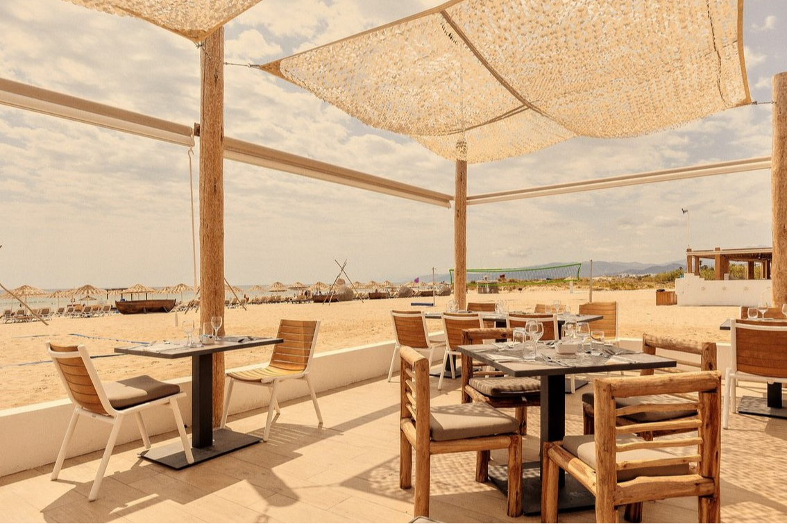 Terrace of the Gibraltar restaurant at Club Med Yasmina, located on the beach, featuring a chic bohemian ambiance and sea views. Terrace of the Gibraltar restaurant at Club Med Yasmina, located on the beach, featuring a chic bohemian ambiance and sea views.