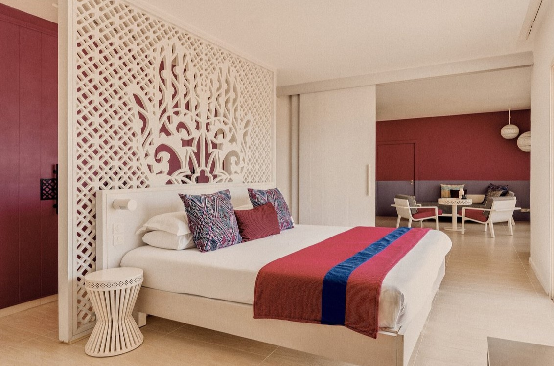 Elegant interior of the Sultana suite at Club Med Yasmina, featuring a spacious bedroom and a separate lounge area. Elegant interior of the Sultana suite at Club Med Yasmina, featuring a spacious bedroom and a separate lounge area.