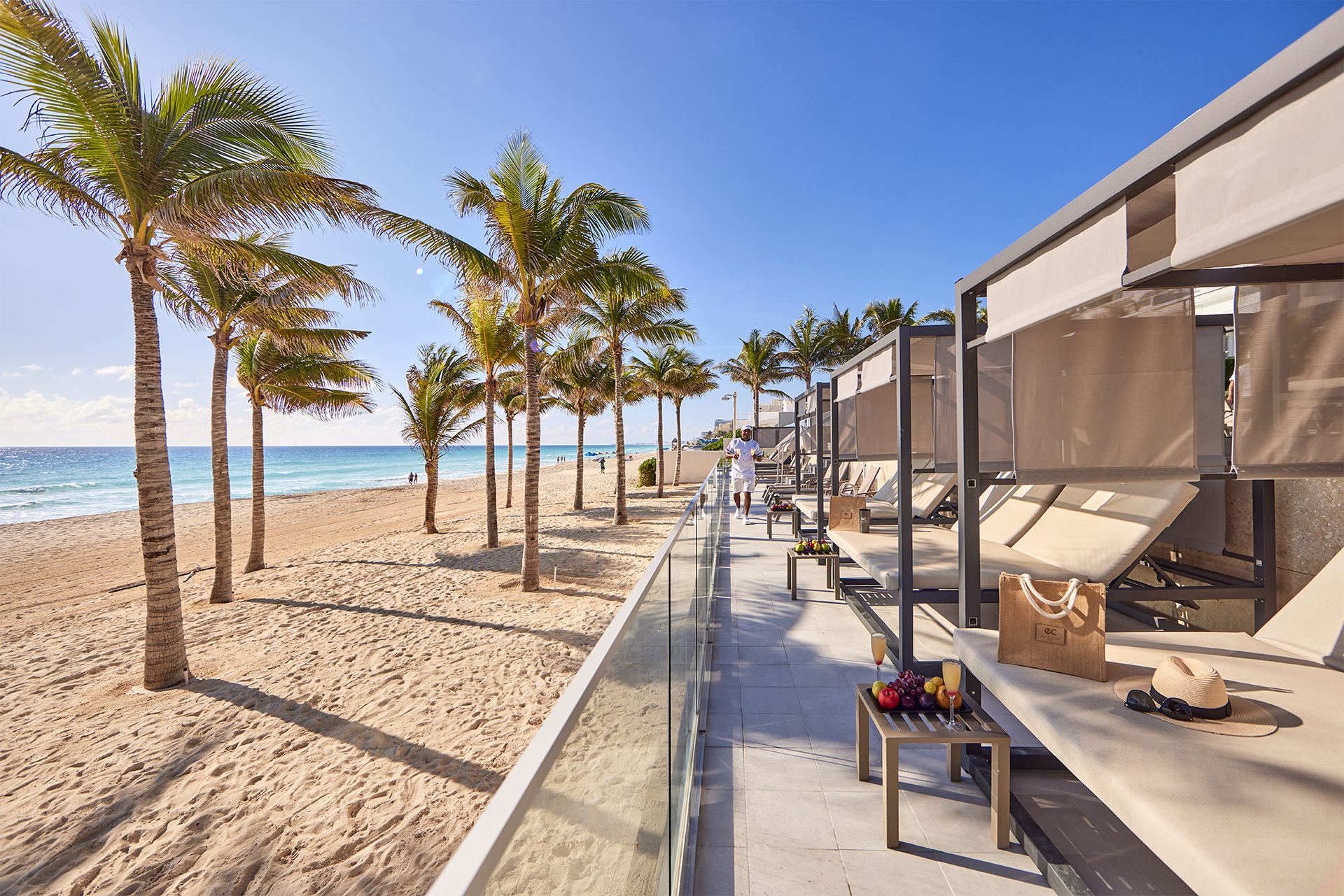 Riu Palace Kukulkan Cancun Hotel Zone Mexico Kukulkan Boulevard cabanas on the beach with palm trees and sea views